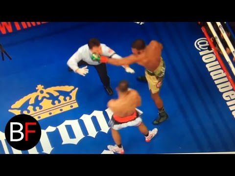 Boxing referee gets punched after the round!