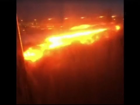 Raw: Singapore Jet Catches Fire After Landing