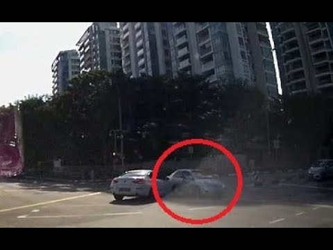 Bizarre moment car appears from nowhere at a busy junction to cause crash