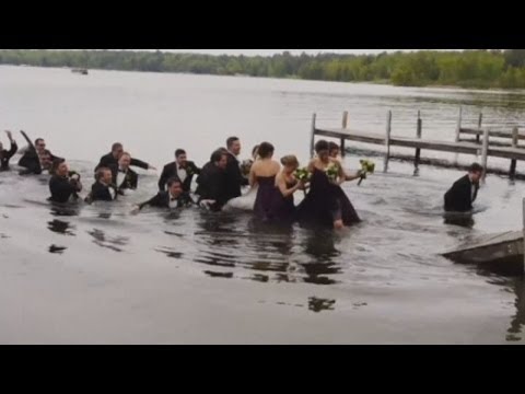 WATCH: Wedding party falls into lake when dock collapses