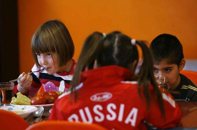 Orphan children have a meal at an orphanage in the southern Russian city of Rostov-on-Don