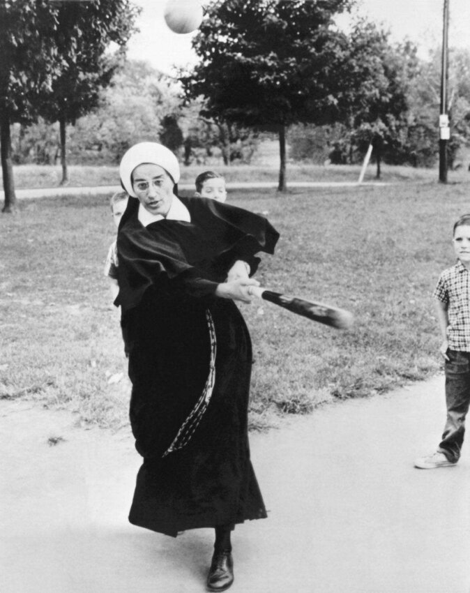 A nun who cares for the boys at the St Thomas Orphanage also teaches them a couple of things about baseball, Louisville, Kentucky, October 1965. (Photo by Underwood Archives/Getty Images)