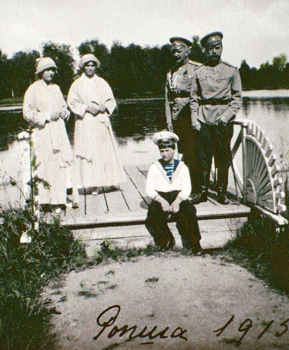 ROSPHA, RUSSIA - 1915: (L-R) Olga Romanov, Tatiana Romanov, Alexei Romanov, unidentified man and Tsar Nicholas II in 1915 in Rospha, Russia. The series of the unique pictures were taken by the Tsar Nicholas II himself or people close to the royal family. They were realized in 1915-1916, the most terrible years of World War I. Nicholas II was an insatiable photographer. He took special care of pictures, filed them with care in numerous albums. He passed down his love for photography to Maria, his third daughter, who is responsible for colouring most of the pictures. (Photo: Laski Diffusion/Getty Images)