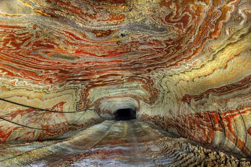 These psychedelic photographs give a rare glimpse inside the walls of an abandoned salt mine. After years of mining deep into the Earths crust, layers of a carnallite now line the tunnels with a spectacular mix of coloured rock. Used in the process of plant fertilisation, the mineral can appear in a variety of colours including white, red, yellow and blue. Although a small part of the mine is still in use, miles of tunnels now lay abandoned & are only accessible with a special government permit