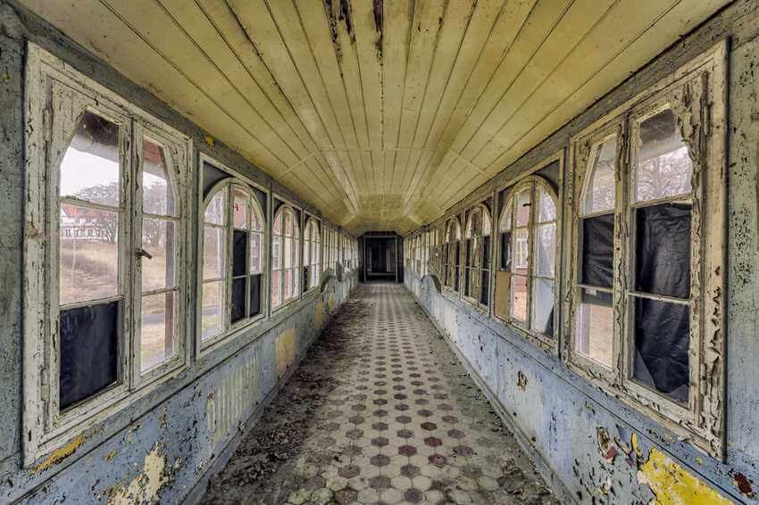 abandoned corridor in hospital with windows and doors