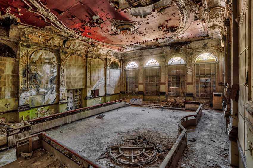 abandoned decay event hall with graffiti and ornament