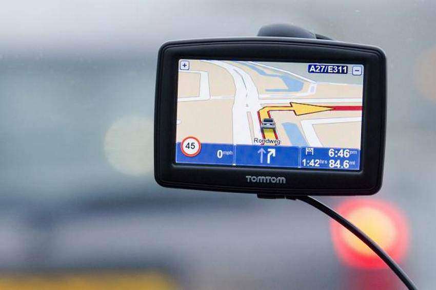 A TomTom navigation device is seen in this photo illustration taken in Amsterdam February 28, 2012. Struggling Dutch vehicle navigation systems maker TomTom said sales and profit will continue to fall this year as more consumers opt for free software on smartphones, hitting it shares. REUTERS/Robin van Lonkhuysen/United Photos (NETHERLANDS - Tags: BUSINESS SCIENCE TECHNOLOGY) - RTR2YL99