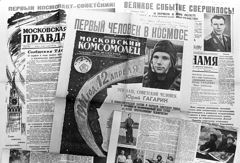 Moscow, Soviet Union. Newspapers inform on Soviet cosmonaut Yuri Gagarin's successful space flight. Headlines read: 'Soviet Cosmonaut is First!', 'First Human in Space', 'Great Thing Happened' 