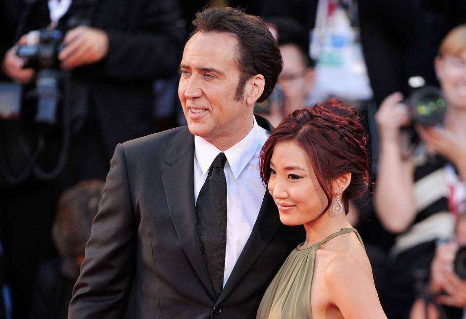 Actor Nicolas Cage and his wife Alice Kim Cage attend the 'Joe' Premiere during The 70th Venice International Film Festival at Palazzo Del Cinema on August 30, 2013 in Venice, Italy. (Photo by Gareth Cattermole/Getty Images)
