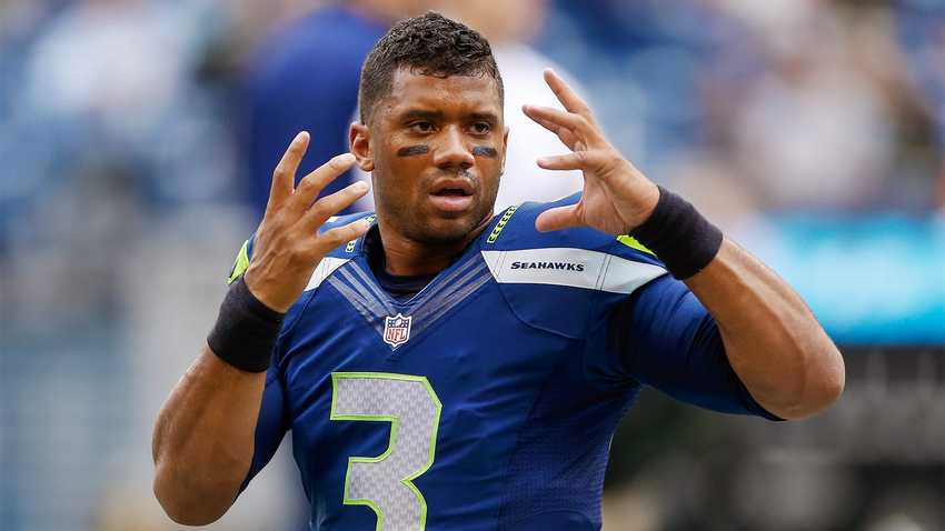SEATTLE, WA - AUGUST 15: Quarterback Russell Wilson #3 of the Seattle Seahawks warms up prior to the game against the San Diego Chargers at CenturyLink Field on August 15, 2014 in Seattle, Washington. (Photo by Otto Greule Jr/Getty Images)