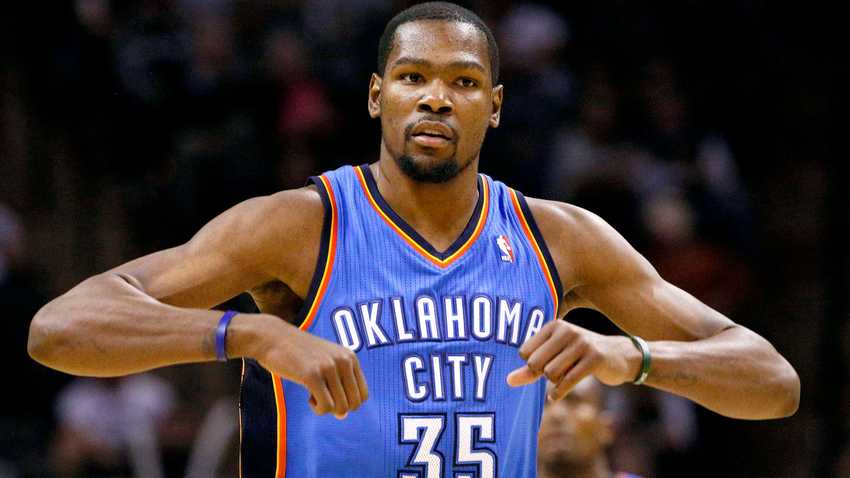 Jan 22, 2014; San Antonio, TX, USA; Oklahoma City Thunder forward Kevin Durant (35) reacts after a shot during the second half against the San Antonio Spurs at AT&T Center. The Thunder won 111-105. Mandatory Credit: Soobum Im-USA TODAY Sports