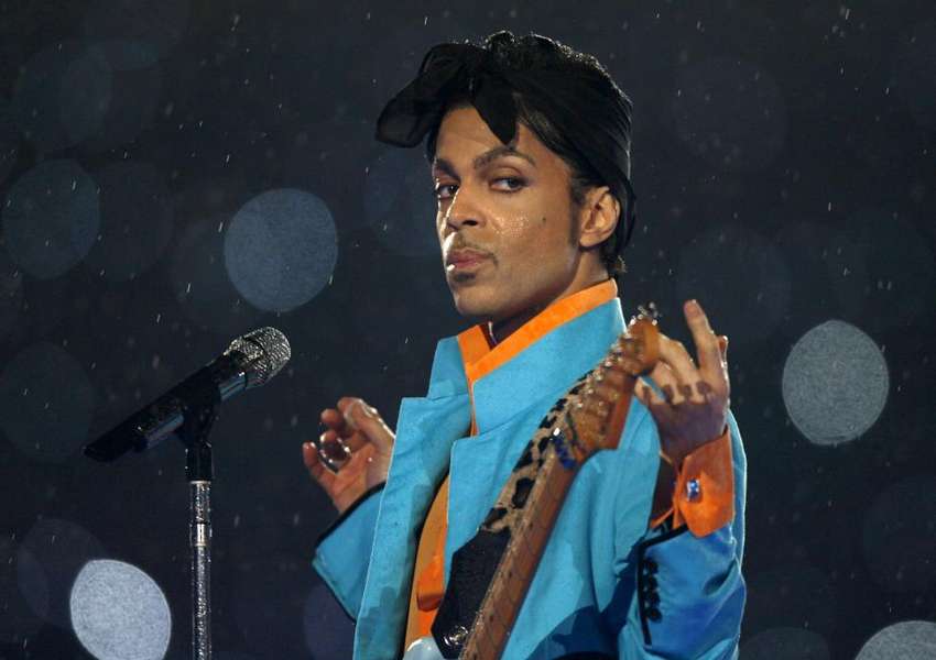 Prince performs during the halftime show of the NFL's Super Bowl XLI football game in Miami